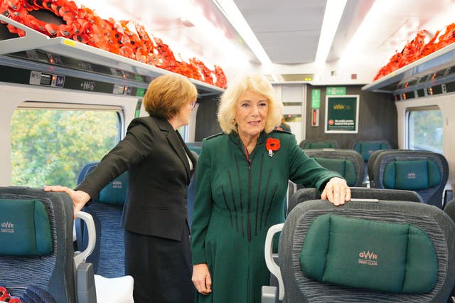 <p>Queen Camilla travels by train from Chippenham in Wiltshire to London Paddington, as part of the Great Western Railway 'Poppies to Paddington' event to mark Armistice Day</p>