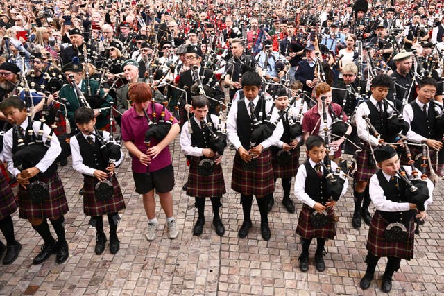 <p>Bagpipers gather to break a world record playing AC/DCs It's a Long Way to the Top </p>