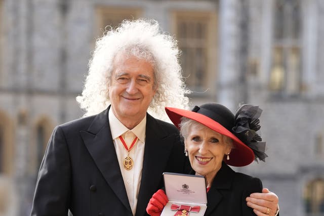 Lady Anita May (Anita Dobson) with her husband Sir Brian May after she was made an Officer of the Order of the British Empire (Andrew Matthews/PA)