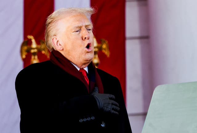 <p>US president Donald Trump sings 'God Bless America' during a Veterans Day ceremony at Arlington National Cemetery in Arlington, Virginia</p>