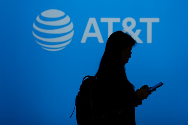 <p>A visitor walks past US multinational telecommunications AT&T logo during the Mobile World Congress (MWC), the telecom industry's biggest annual gathering, in Barcelona on February 26, 2024. The world's biggest mobile phone fair throws open its doors in Barcelona with the sector looking to artificial intelligence to try and reverse declining sales</p>