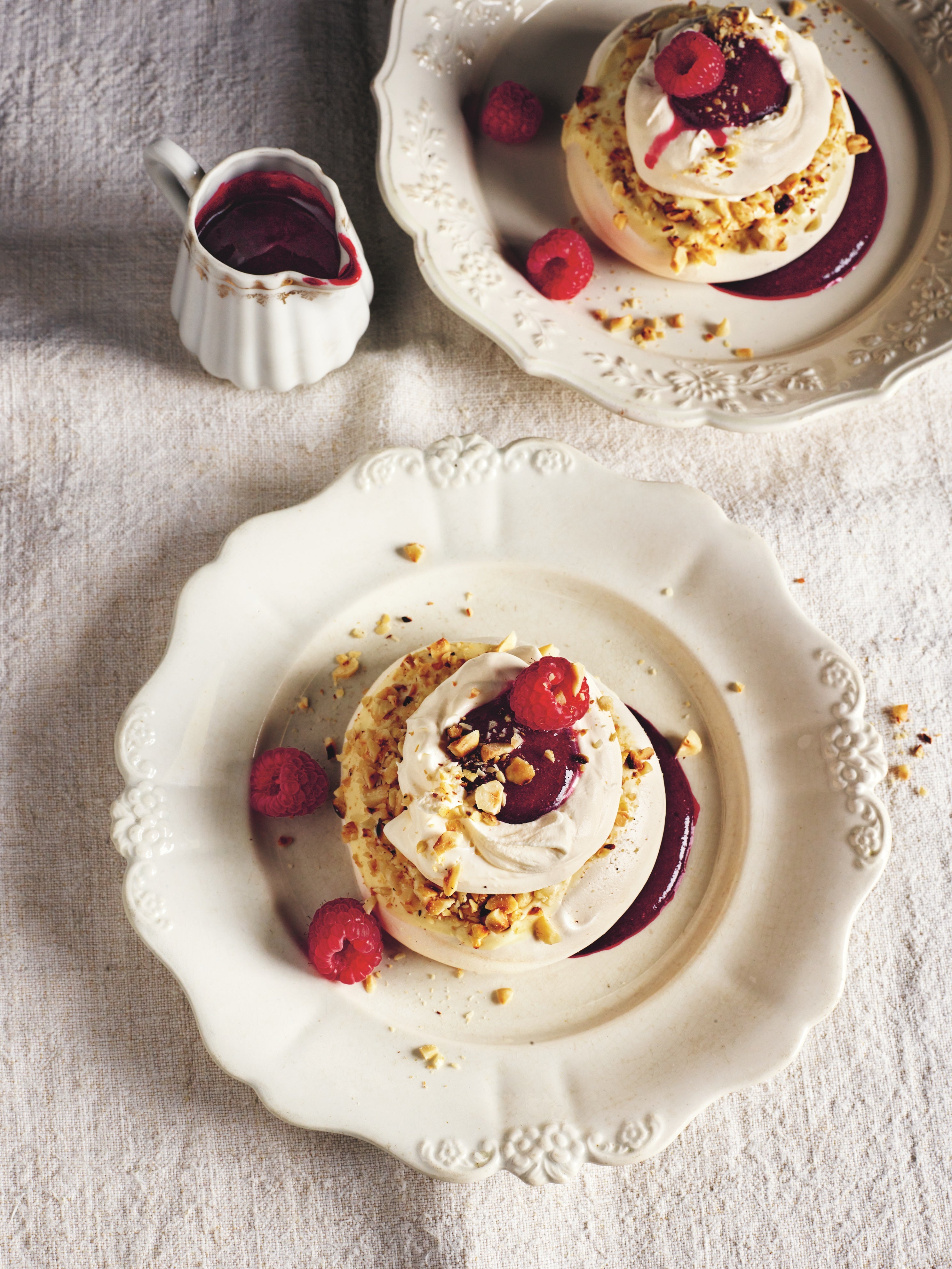 Hazelnut pavlovas with white chocolate and berry sauce – proof that Christmas dessert doesn’t need to be heavy to impress
