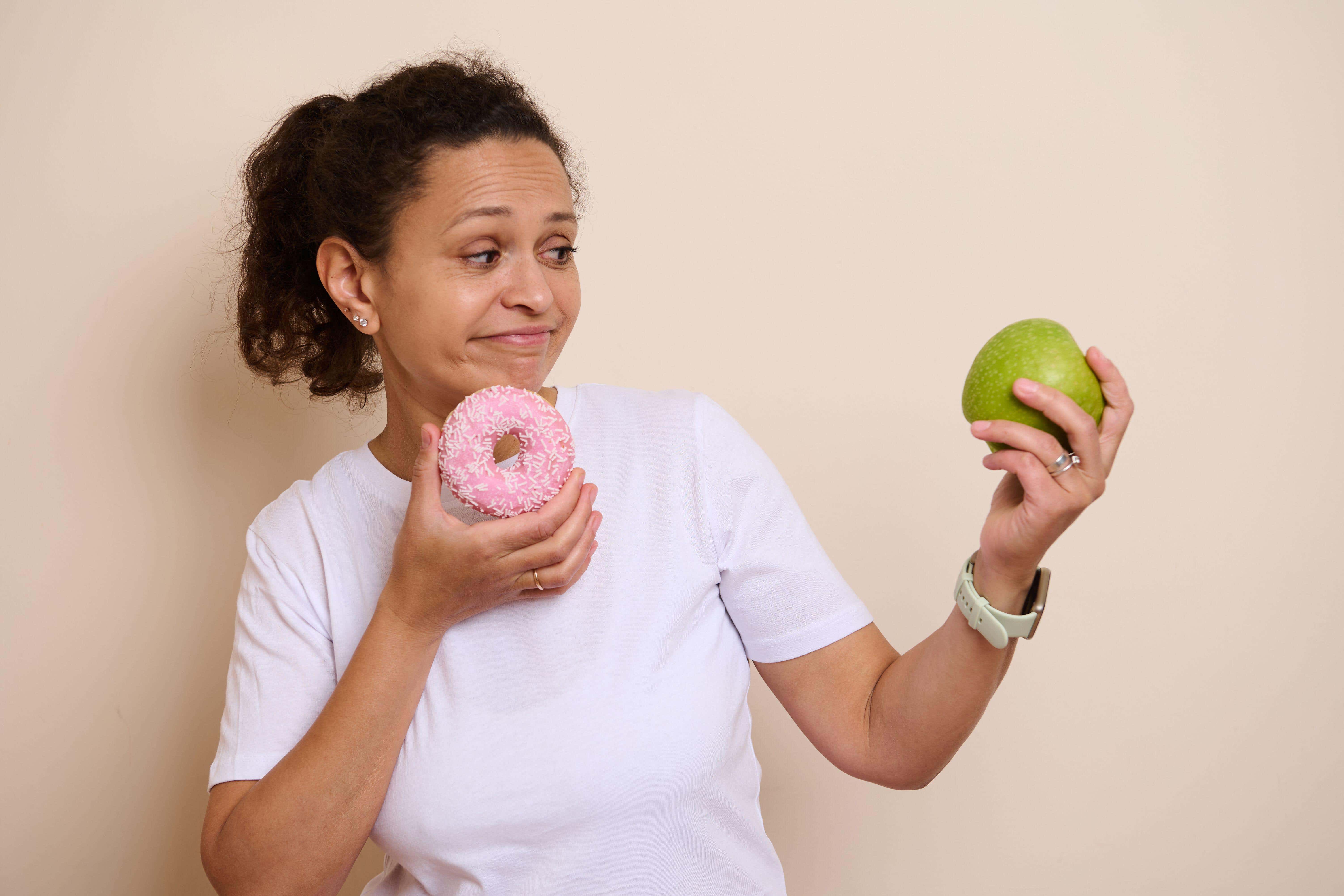 Swap highly processed snacks for whole foods like fruit and nuts (Alamy/PA)
