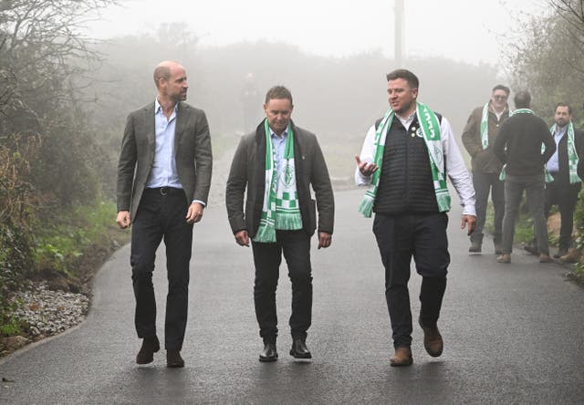 <p>The Prince of Wales, known as the Duke of Cornwall while in Cornwall, speaks with members of the consortium who built the new road,  during a visit to Mousehole AFC at Trungle Parc in Paul, near Penzance, Cornwall</p>