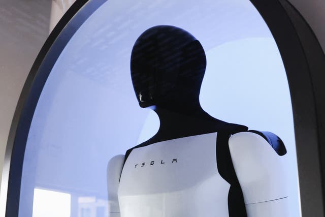 <p>A Tesla Optimus robot is displayed on Santa Monica Blvd in the Hollywood neighborhood Los Angeles, California on 21 July, 2025</p>
