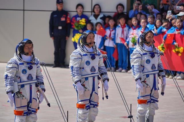 <p>Chen Dong, middle, with Chen Zhongrui, right, and Wang Jie as they attended a send-off ceremony in April </p>