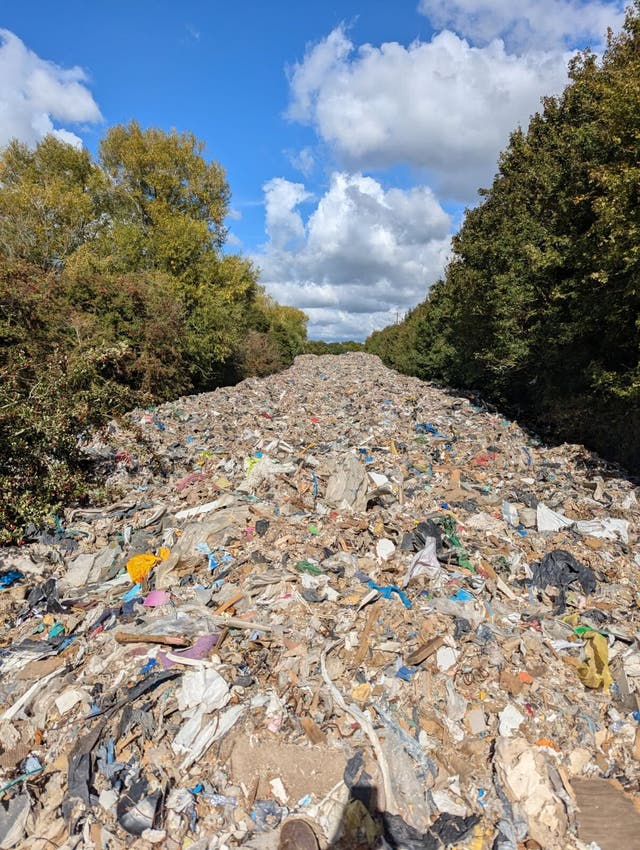 <p>A mountain of waste has been dumped in a field in Oxforshire by fly-tippers </p>