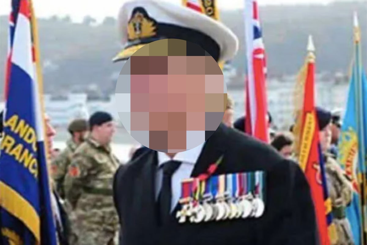 Man arrested after fake rear admiral' gatecrashes Remembrance service