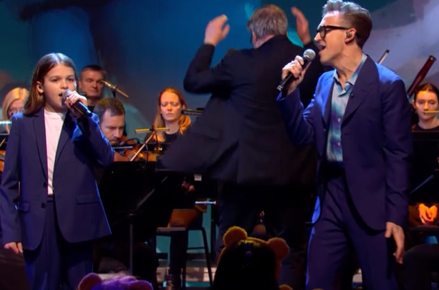 <p>Tom Fletcher sings with his son Buzz on Children in Need</p>