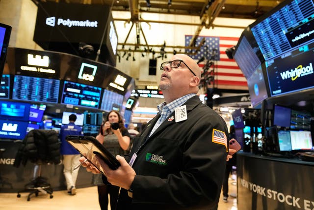 <p>Jeffrey Vazquez works on the floor at the New York Stock Exchange on Thursday</p>