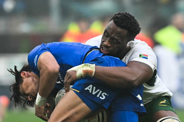 <p>South Africa's flanker Siya Kolisi, right, tackles in Turin</p>