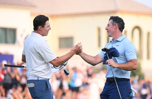 <p>Matt Fitzpatrick of England and Rory McIlroy of Northern Ireland shake hands on the 18th green following the play-off </p>