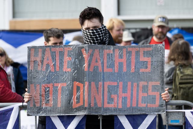 People take part in a Stand Up To Racism counter protest during a protest by people attending a Save Our Future & Our Kids Futures protest outside the Cladhan Hotel in Falkirk (Lesley Martin/PA)
