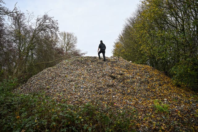 <p>A large pile of fly-tipped waste, dumped in a field between the River Cherwell and the A34 near Kidlington, Oxfordshire</p>