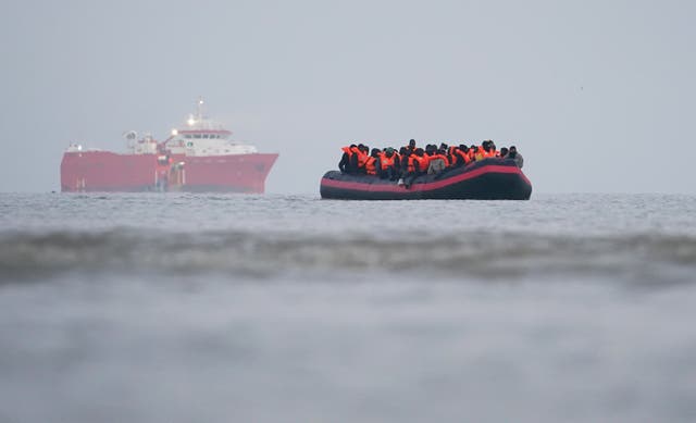 <p>People thought to be migrants on board a small boat in Gravelines, France </p>