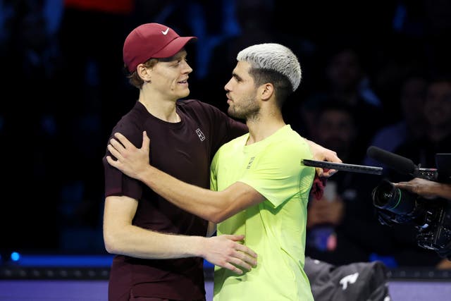 <p> Jannik Sinner and Carlos Alcaraz embrace after the ATP Finals in Turin</p>