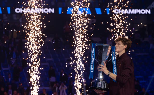 <p>Jannik Sinner from Italy celebrates with the trophy after victory in the ATP Finals against Carlos Alcara</p>