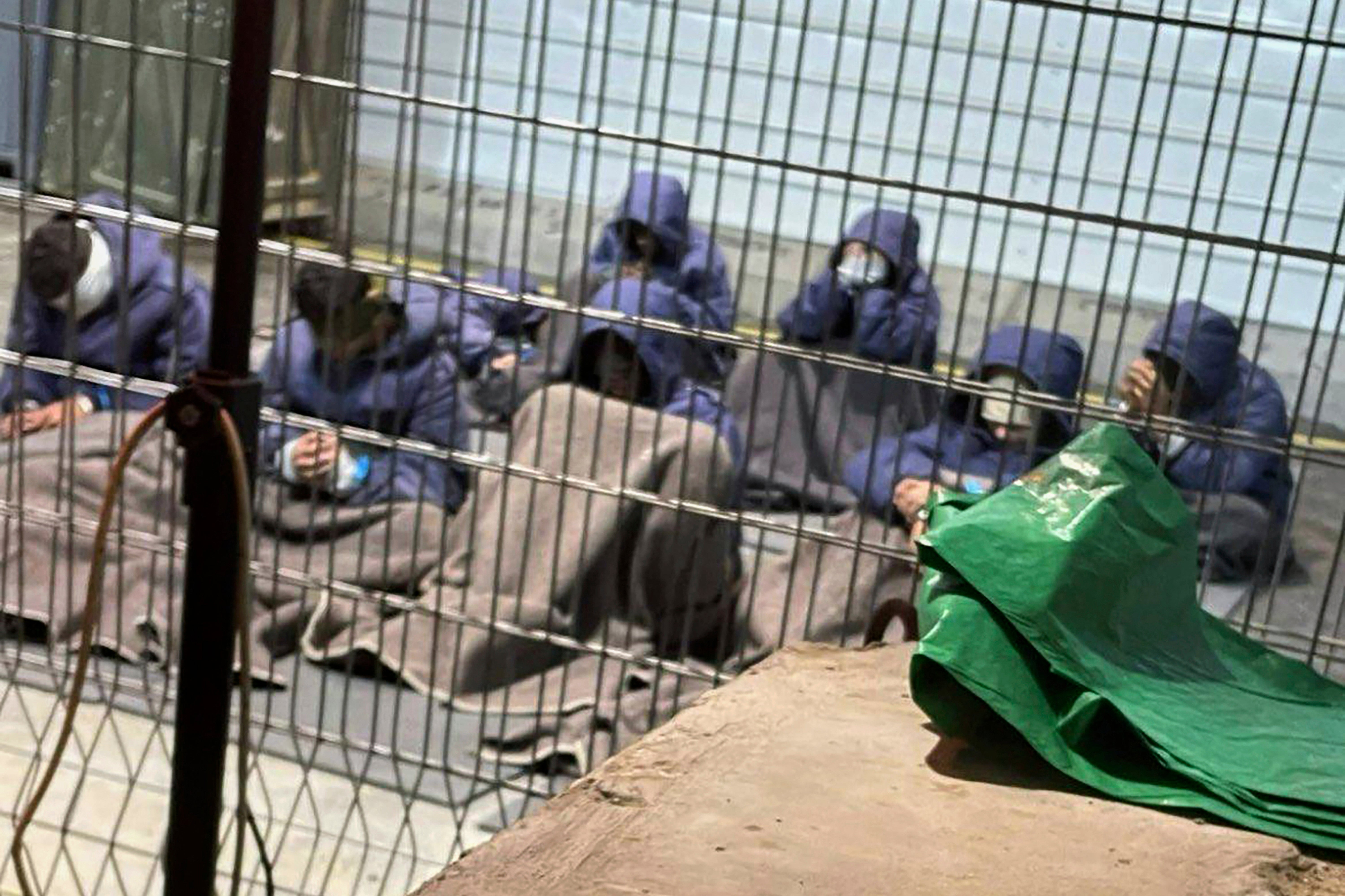 <p>This 2024 photo provided by Breaking The Silence, a whistleblower group of former Israeli soldiers, shows prisoners with their hands and legs restrained in the yard at the Sde Teiman military prison in southern Israel. (Breaking The Silence via AP)</p>