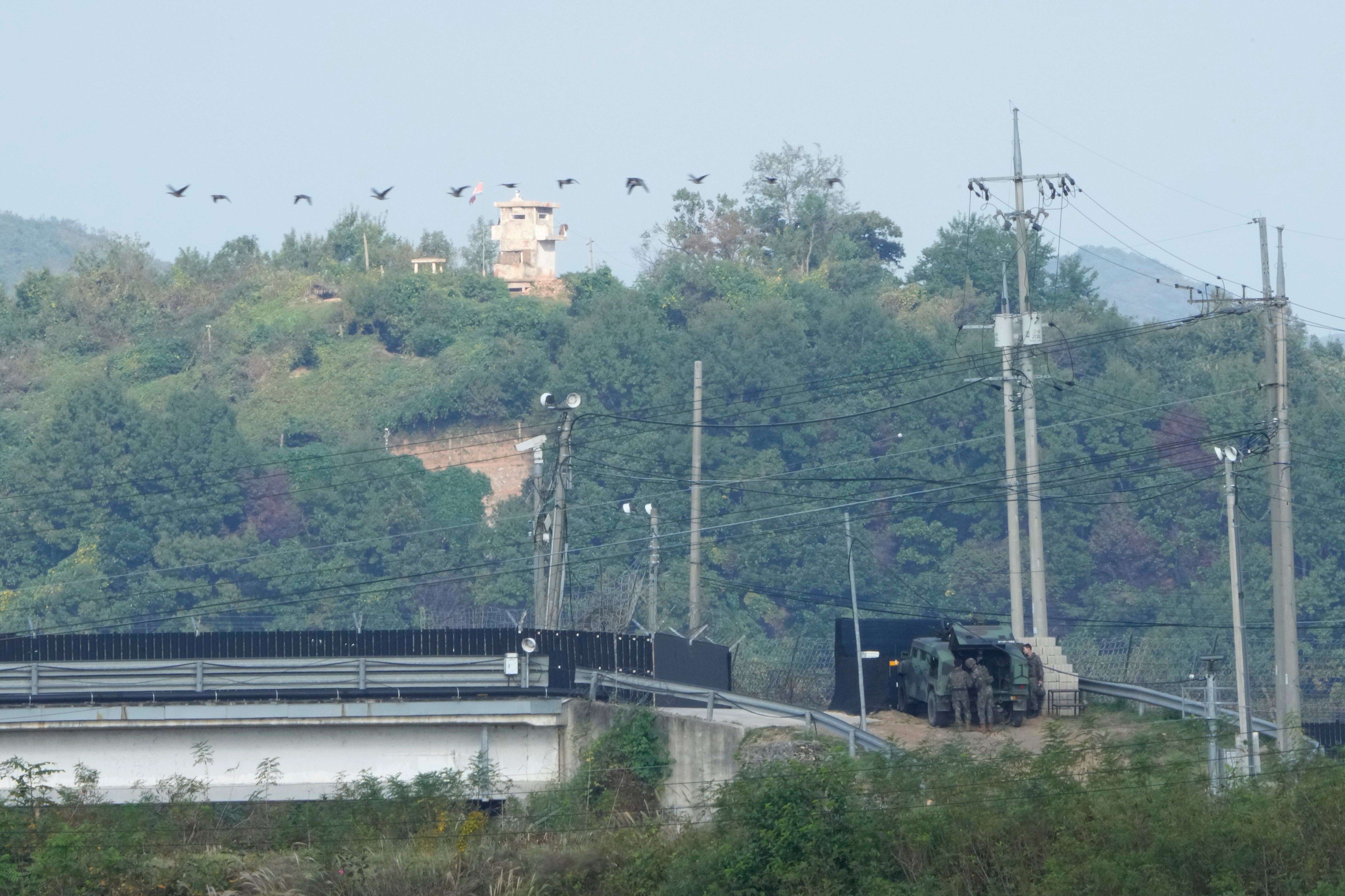 <p>A North Korean military guard post, top, and South Korean army soldiers, bottom, are seen from Paju, South Korea, near the border with North Korea, on Oct. 10, 2024. (AP Photo/Ahn Young-joon, File)</p>