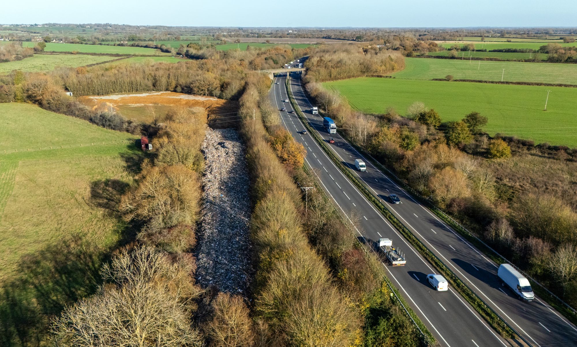 An aerial view of the huge pile of illegally dumped waste by the A34 in Kidlington, Oxfordshire