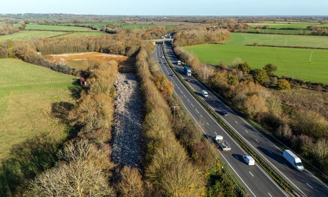 <p>An aerial view of the huge pile of illegally dumped waste by the A34 in Kidlington, Oxfordshire</p>