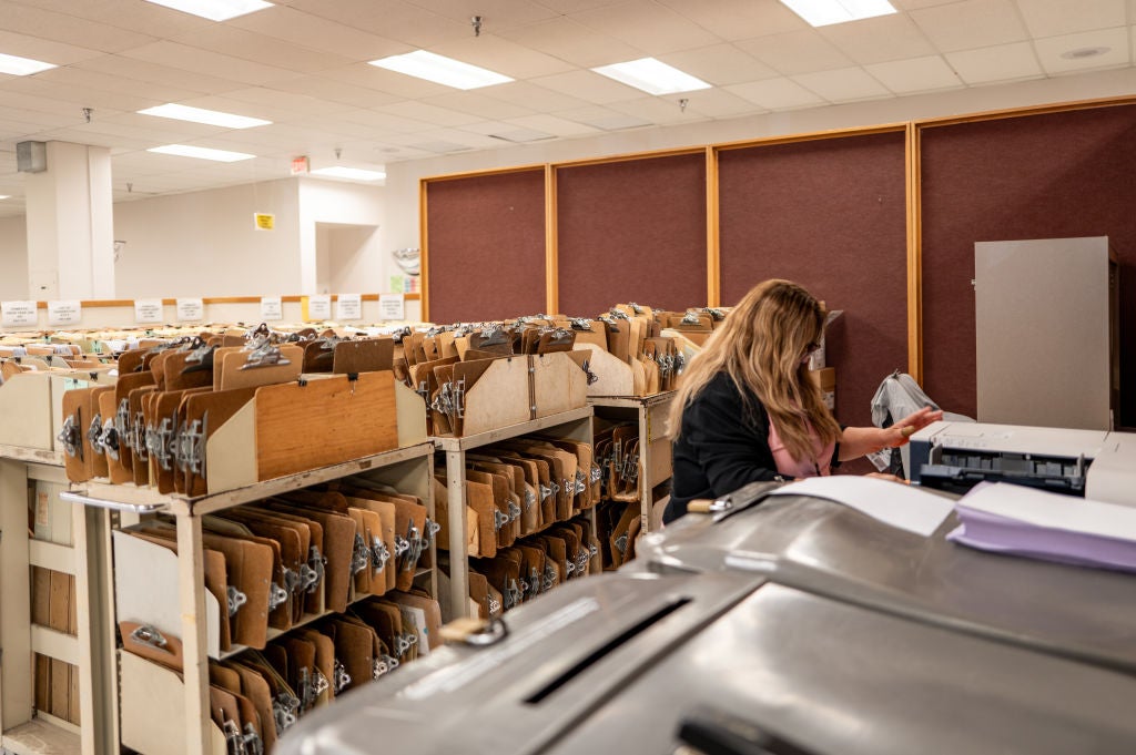 An employee sorts through documents at an IRS Processing Facility in Austin, Texas. The federal tax agency announced new brackets in October, which are typically adjusted each year to account for inflation