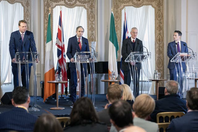 Jim O’Callaghan, Simon Harris, Hilary Benn and Matthew Patrick speaking after the British-Irish Intergovernmental Conference (Conor O Mearain/PA)