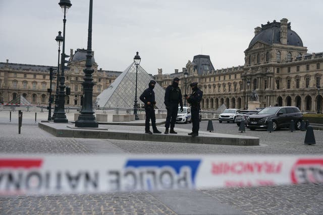 <p>French police officers patrol in front of the Louvre Museum after it was robbed, with the Louvre Pyramid designed by Ieoh Ming Pei in the background, in Paris on October 19, 2025</p>