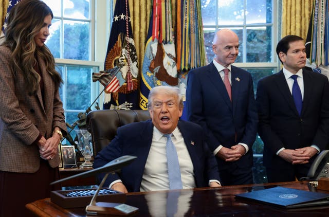 <p>U.S. President Donald Trump speaks while U.S. Homeland Security Secretary Kristi Noem, FIFA President Gianni Infantino and U.S. Secretary of State Marco Rubio stand by his side, as he meets with the White House Task Force on the FIFA World Cup 2026 in the Oval Office at the White House in Washington, D.C., U.S., November 17, 2025. REUTERS/Evelyn Hockstein</p>