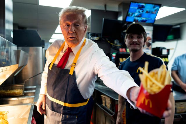<p>Then-presidential nominee Donald Trump works behind the counter during a campaign event at a McDonald's restaurant on October 20, 2024, in Feasterville-Trevose, Pennsylvania</p>