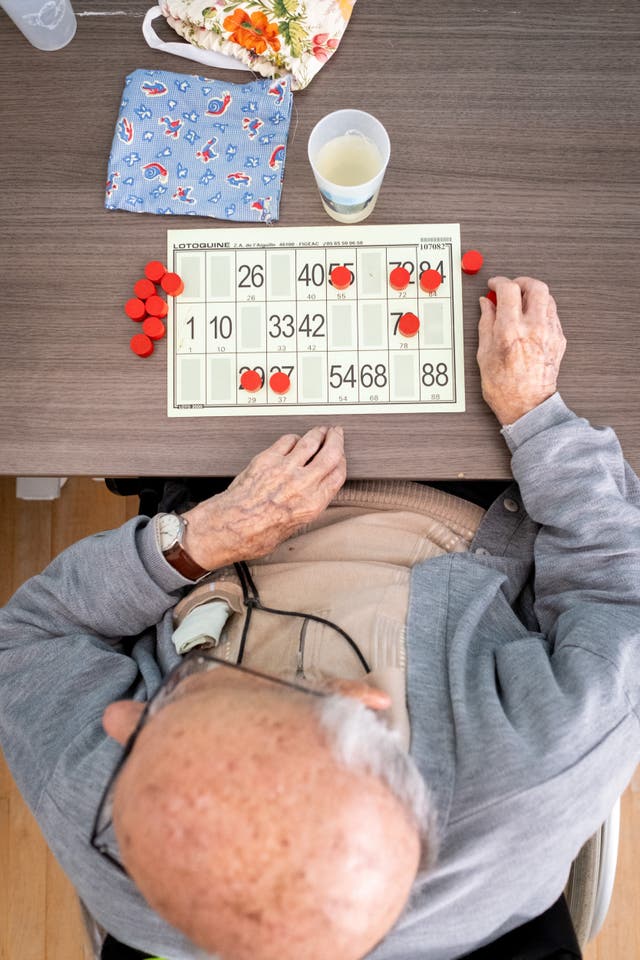 <p>File. Resident participates in a bingo game at a retirement nursing care home</p>