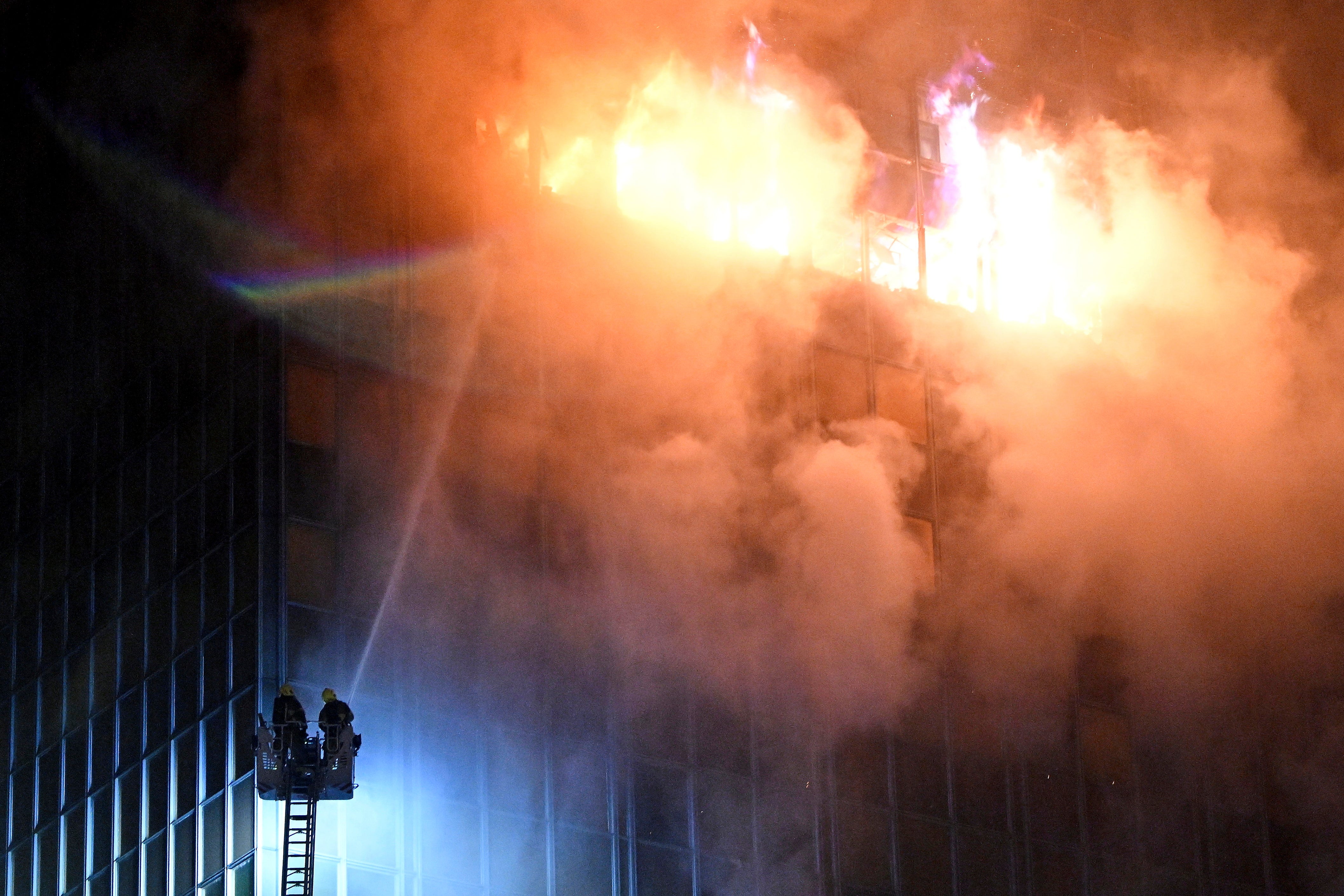 <p>Firefighters extinguish the blaze that caught the Vjesnik skyscraper</p>