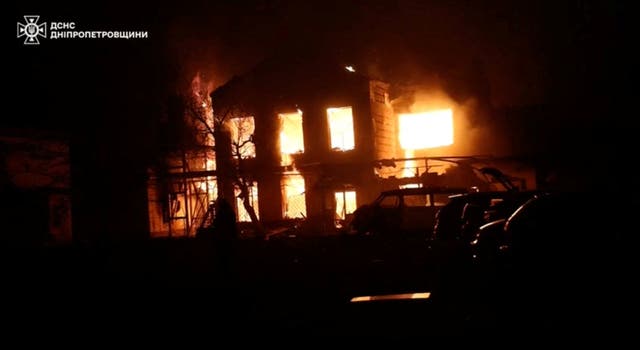 <p>Smoke and flames rise from a building at the site of a Russian drone strike, amid Russia's attack on Ukraine, in a location given as Dnipropetrovsk region, Ukraine</p>