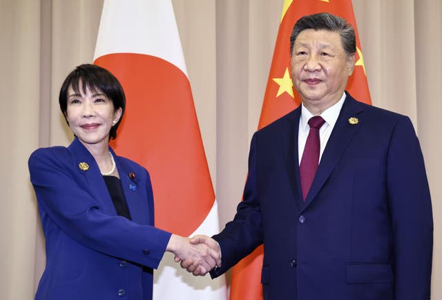 <p>Chinese president Xi Jinping, right, shakes hands with Japanese prime minister Sanae Takaichi ahead of their meeting in Gyeongju, South Korea, 31 October 2025</p>
