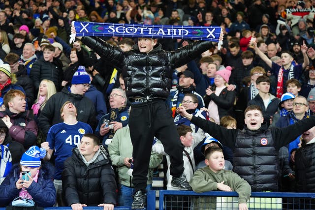 Scotland fans celebrate after they qualified for the 2026 World Cup (Jane Barlow/PA)