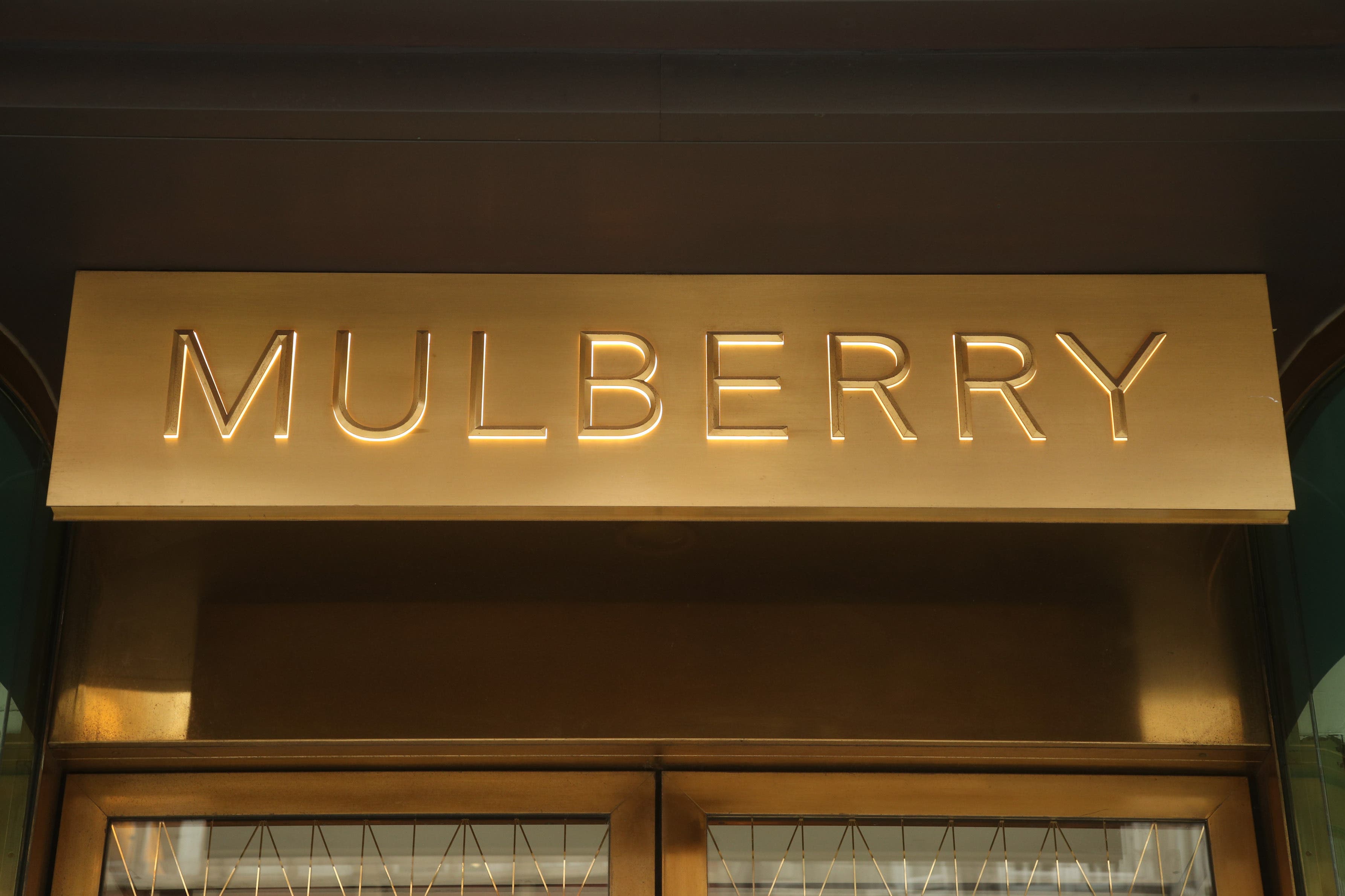 Luxury fashion firm Mulberry has slashed its losses by more than half amid its major turnaround efforts (Yui Mok/PA)