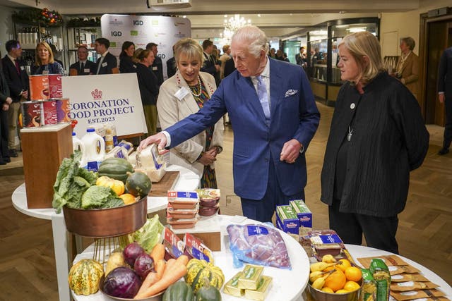 Charles chats to Dame Martina Milburn (left) and Dame Louise Casey as he joins chief executives and senior leaders from Alliance Food Sourcing at Fortnum and Mason (PA)