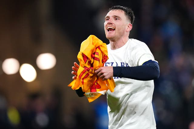 Andy Robertson celebrates after leading Scotland to the World Cup (Jane Barlow/PA)