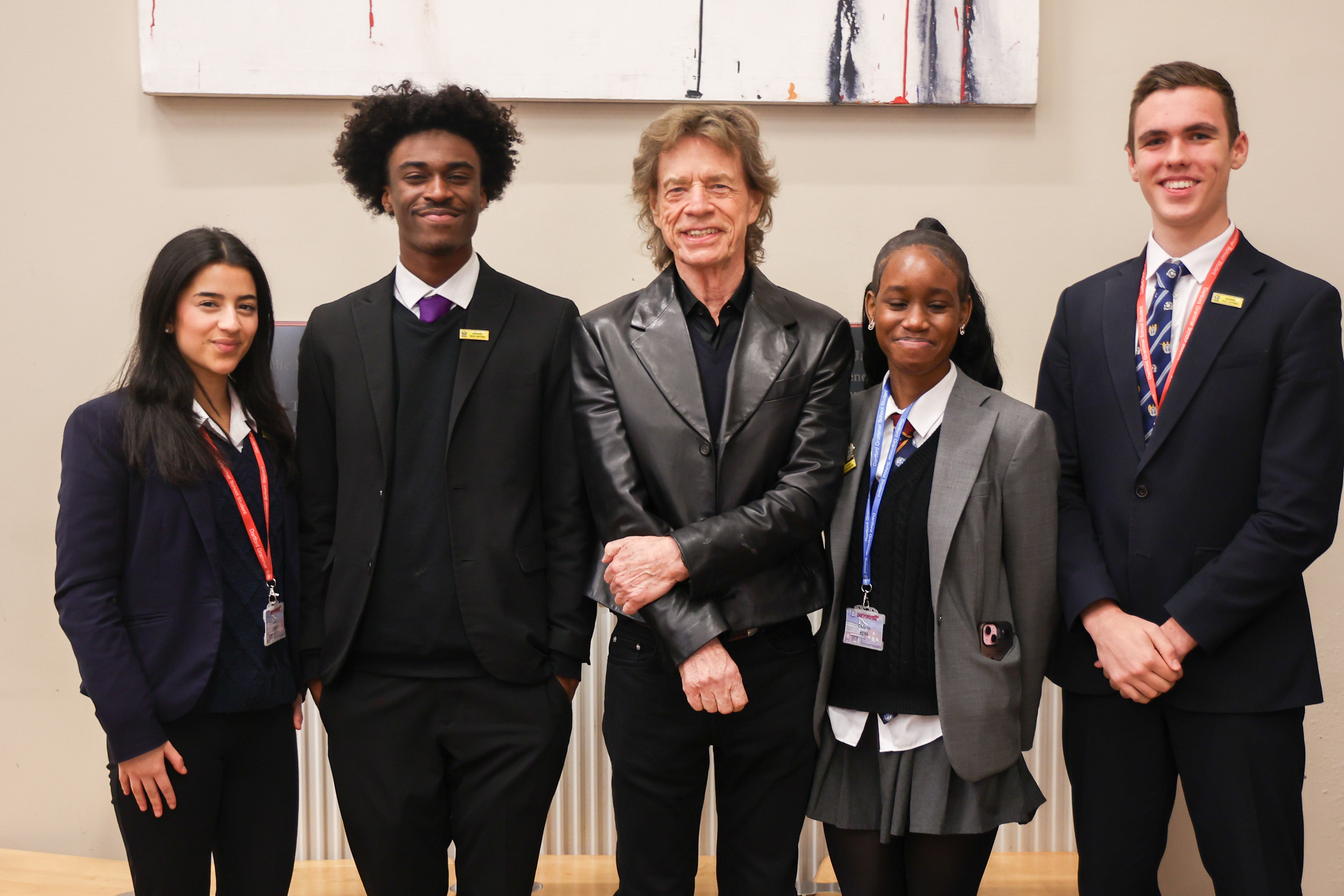 Sir Mick Jagger met students during a surprise visit to his old school