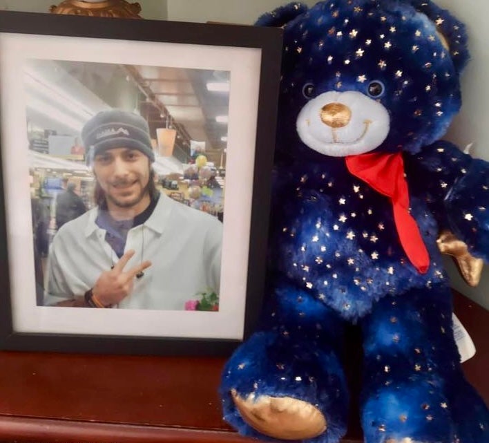 A photograph of Mary Cutter’s only son, Christian, is framed beside a teddy bear gifted to her by Payton Herres. It plays the sound of his heartbeat when the right paw is squeezed