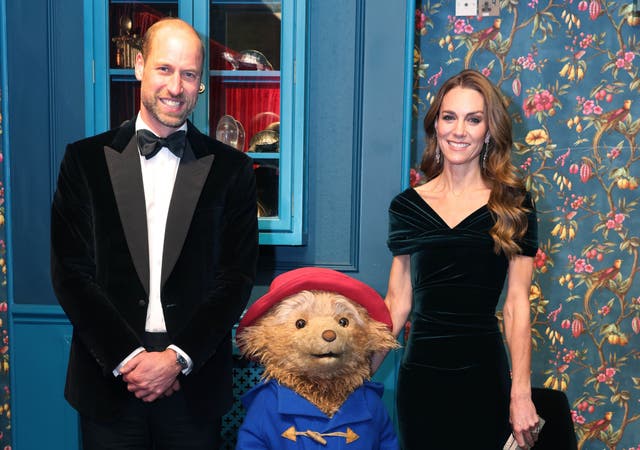 <p>Kate and William pose with Paddington Bear</p>