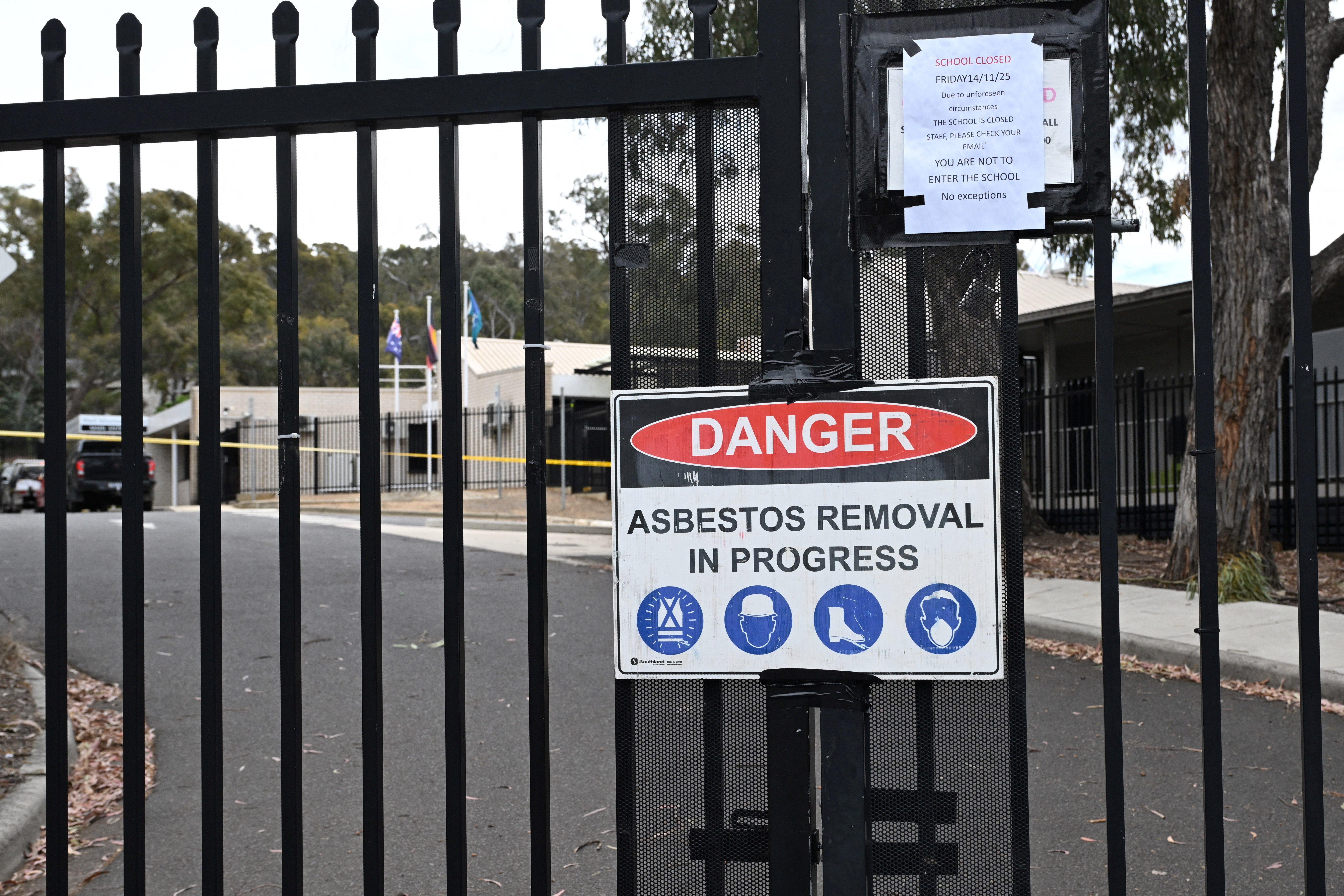 <p>An asbestos warning sign is displayed at Black Mountain School in Canberra</p>
