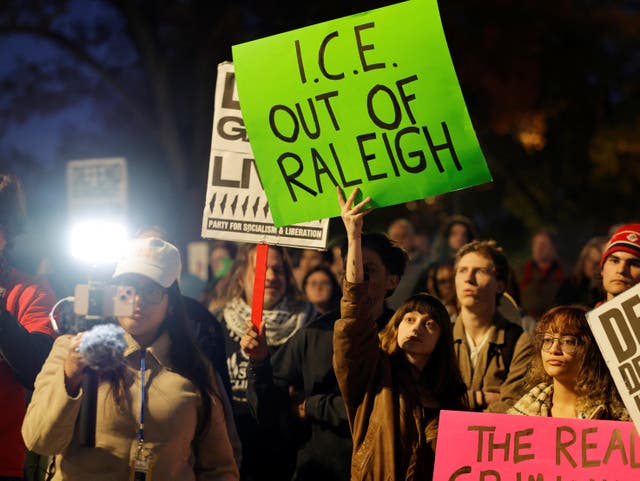 <p>Protesters marched through downtown Raleigh, North Carolina, as federal immigration agents were spotted nearby</p>