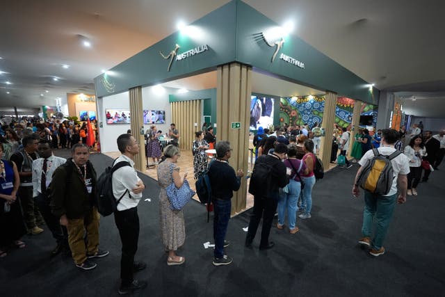 <p>People line up at the Australia Pavilion with the Turkey Pavilion, back left, during the Cop30 UN Climate Summit</p>