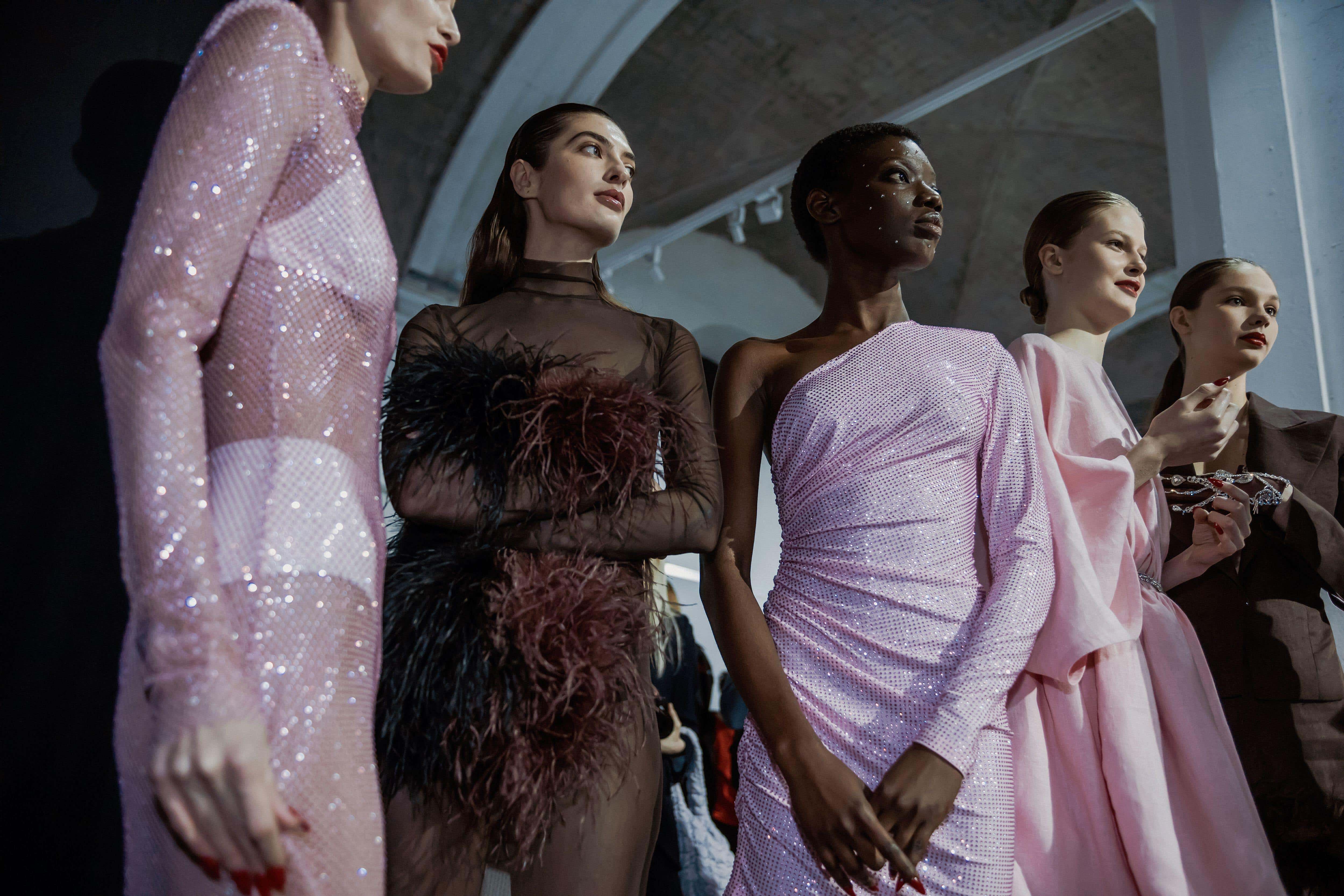 Mesh, feathers and sparkles are in for festive fashion 2025 (Alamy/PA)