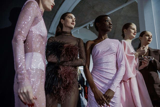 Mesh, feathers and sparkles are in for festive fashion 2025 (Alamy/PA)