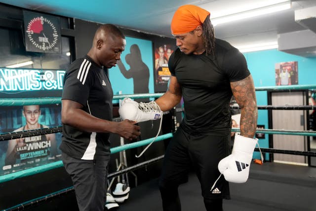 Anthony Yarde, right, with trainer Tunde Ajayi at a media day at Dennis & Dyer Boxing Academy in October (Lucy North/PA)