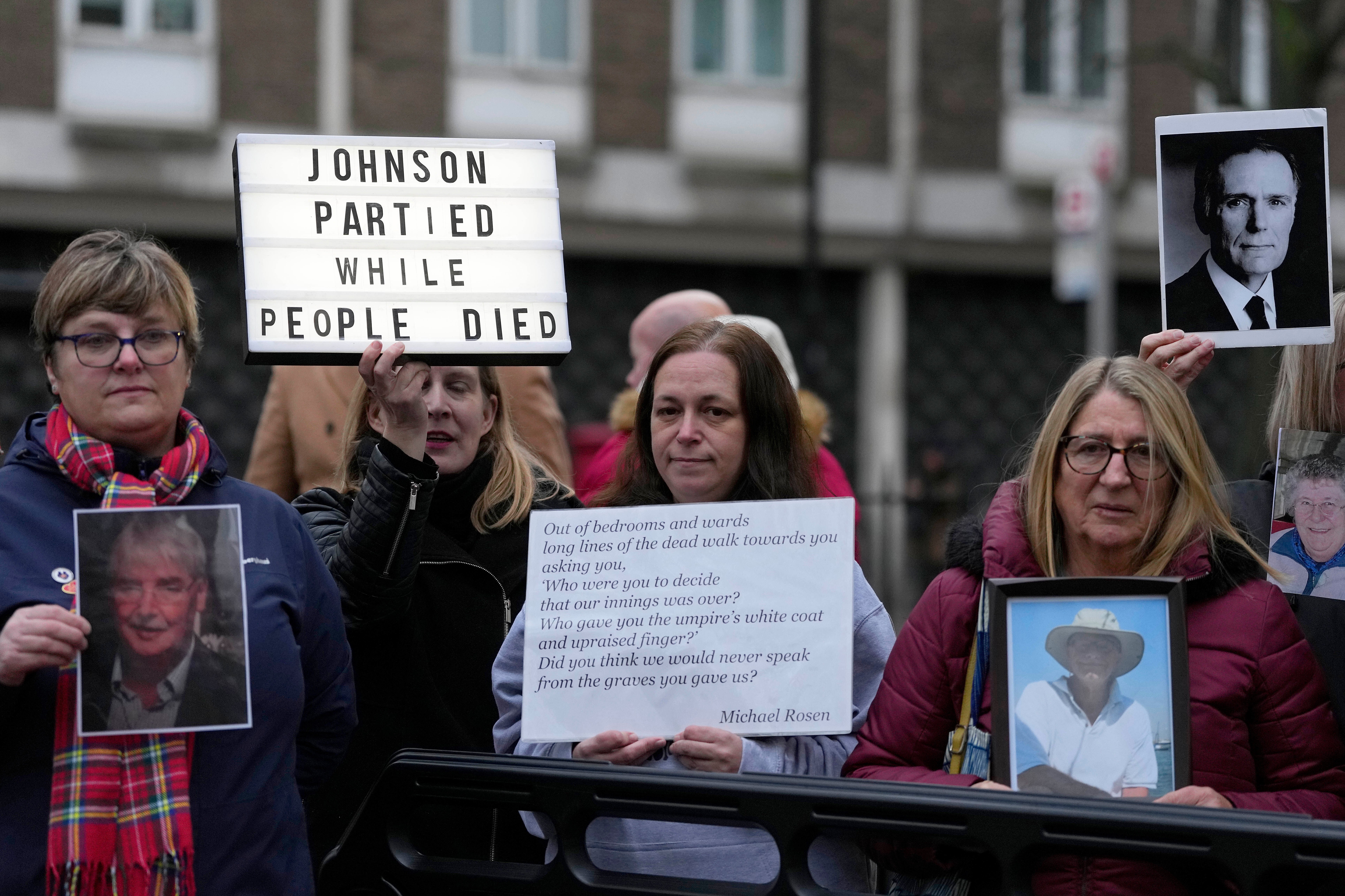 Protesters outside the Covid inquiry when Johnson gave evidence
