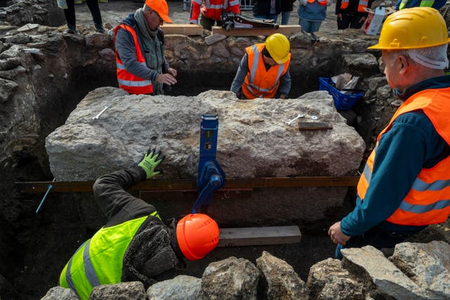 <p>Workers securing the lid of intact Roman sarcophagus for lift at an archeological site in Budapest, Hungary, Sept. 30, 2025. (Gabor Lakos, Budapest History Museum via AP)</p>