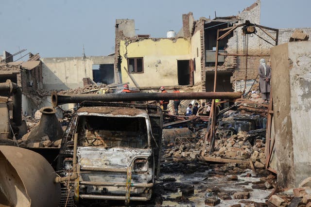 <p>Rescue workers search for survivors after an explosion at a factory in Faisalabad, Pakistan, on 21 November 2025 </p>